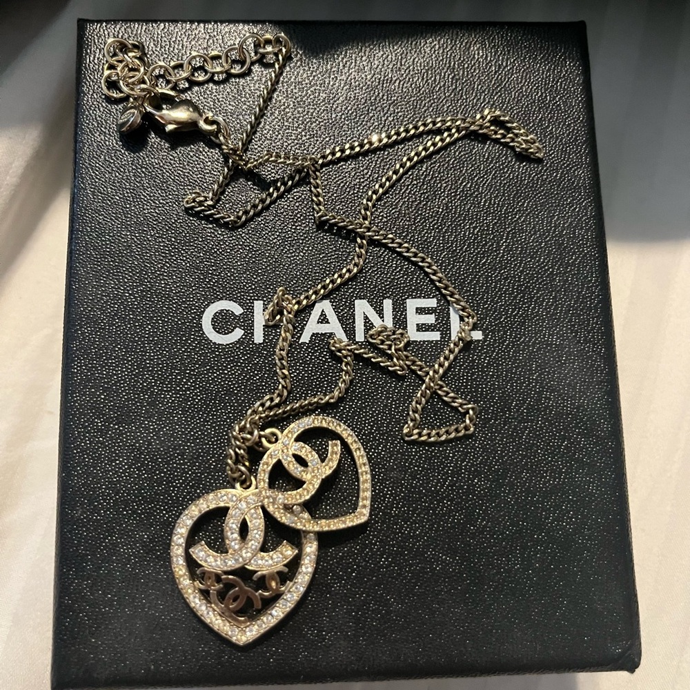 Chanel gold necklace with two logo heart charms